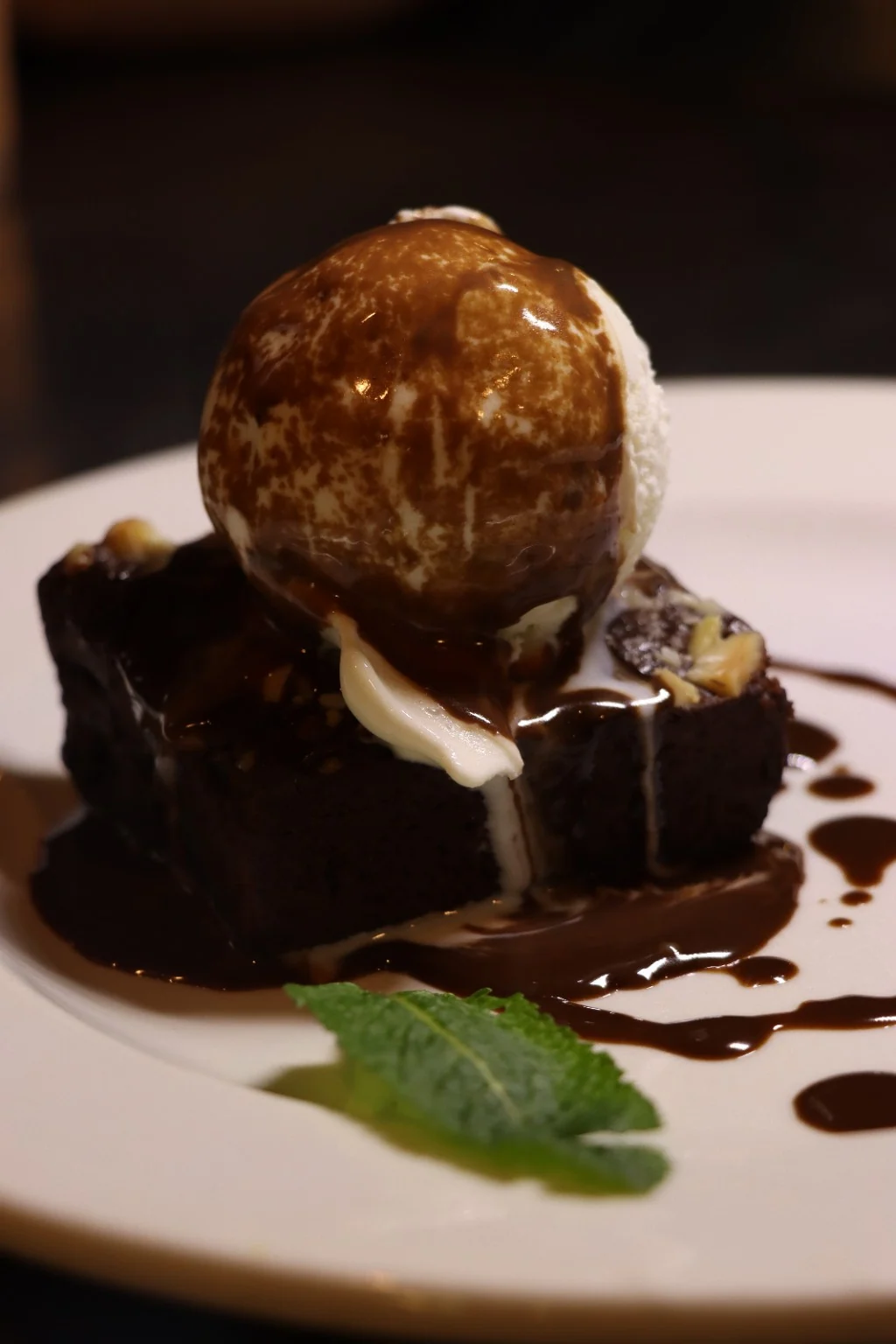 Chocolate brownie with vanilla ice cream and chocolate sauce