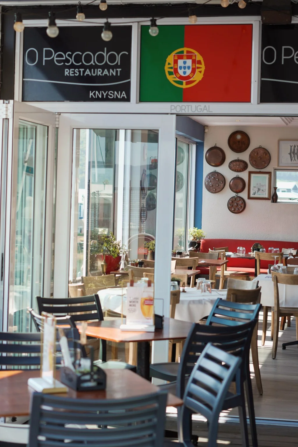 Sunlit tables inside O Pescador